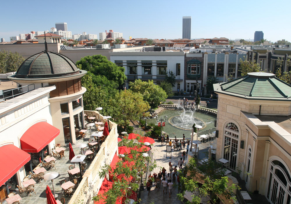 The Grove outdoor shopping center with fountain and seating located in Los Angeles, California. 