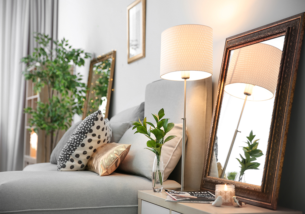 Staged bedroom featuring mirrored frame