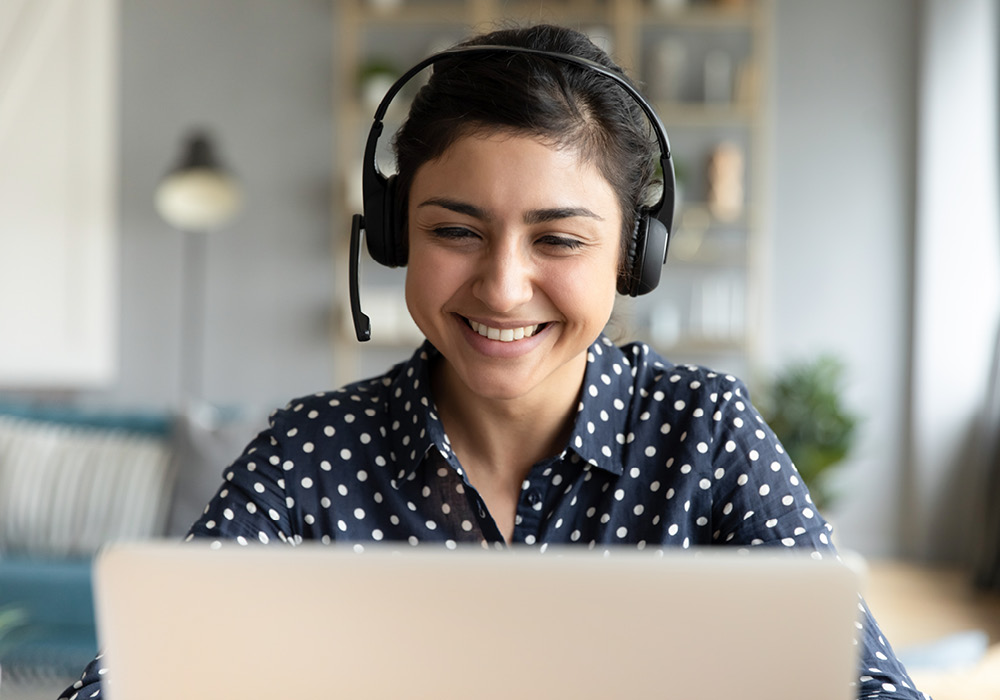 Woman working from home in her apartment.