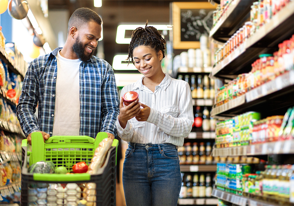 Man and woman shopping in grocery aisle
